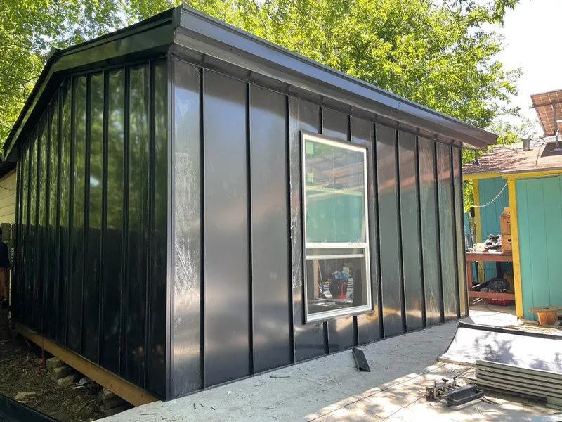 Black standing seam metal wall panels for Roof Inspection in Upper Grand Lagoon